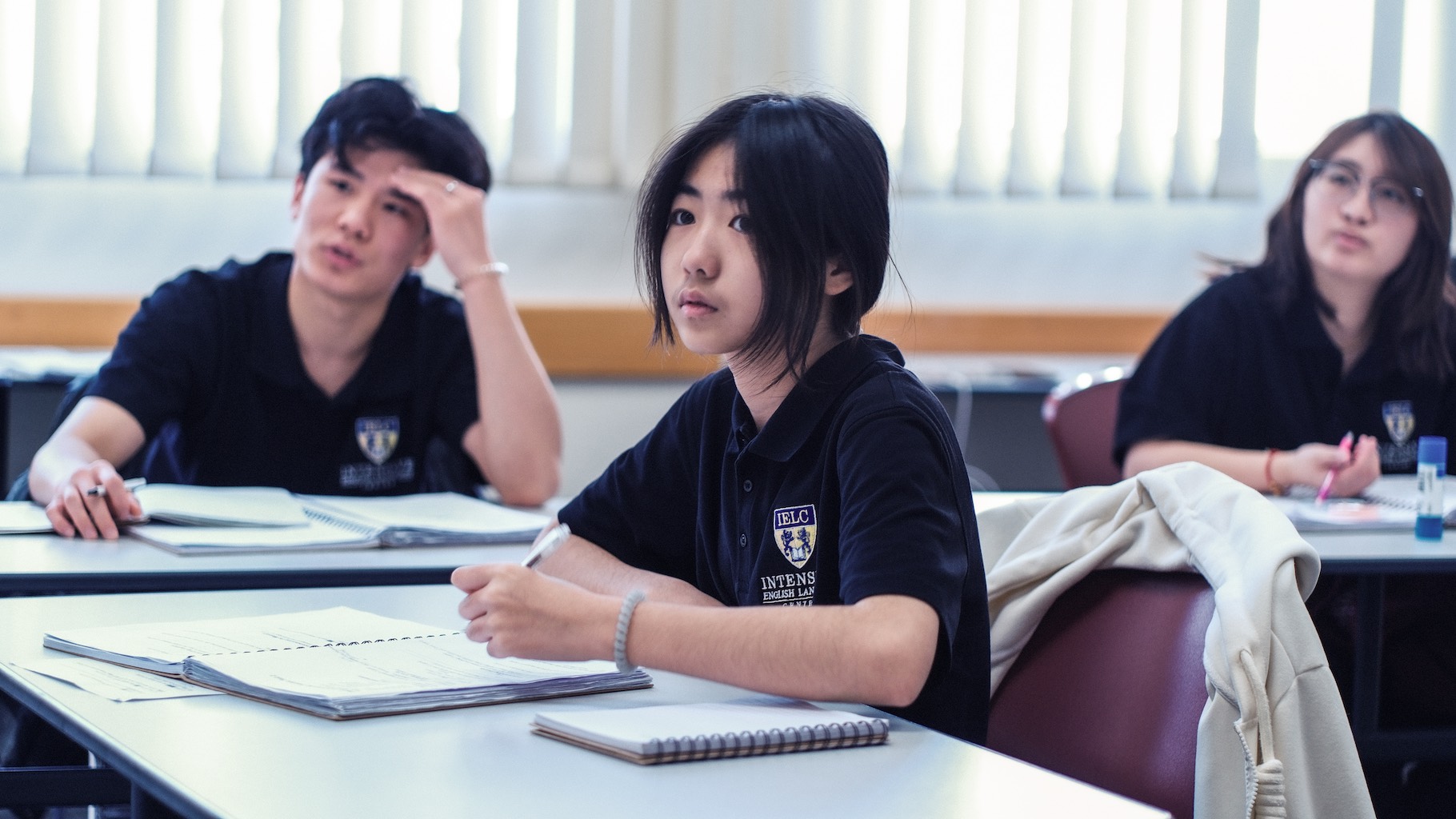 Students focused on a classroom lesson
